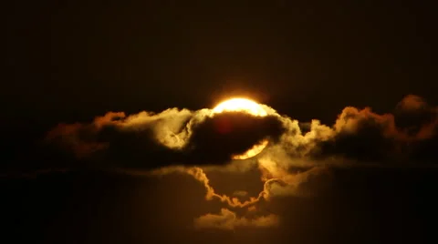 ORANGE SUN HIDES BEHIND DARK BLACK CLOUDS Stock Footage 59071166
