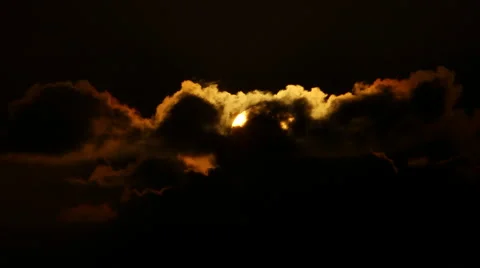 ORANGE SUN HIDES BEHIND VERY DARK BLACK CLOUDS Stock Footage 59071191