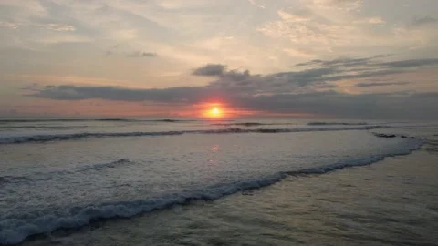 Orange sun setting over the horizon Stock Footage 166561712