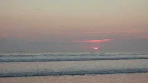 Orange sun setting over surf , Seminyak Beach, Bali Video stock 336514837