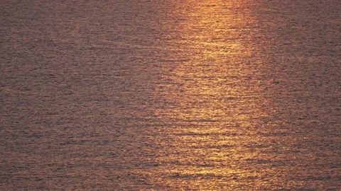 Orange sunlight on the sea surface Video stock 169405649