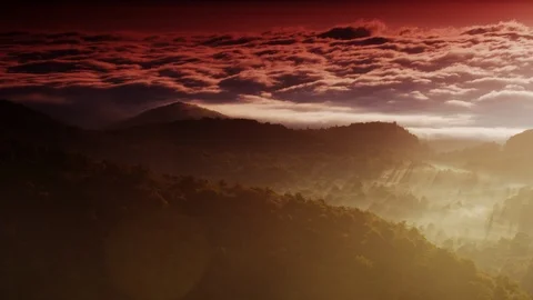 Orange sunrise light over clouds and morning valley fog Stock Footage 103401184