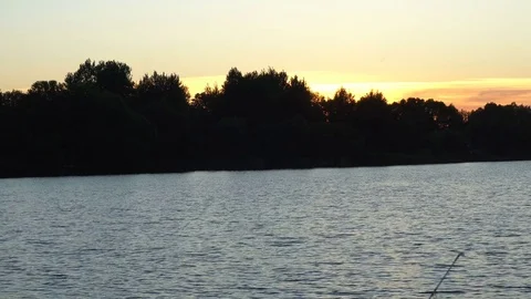 Orange sunrise over the river on forest background Vidéo 76139251