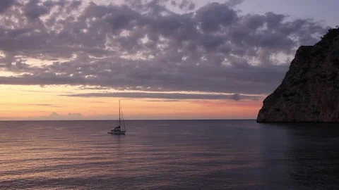 Orange Sunrise with sailboat Video stock 84792147