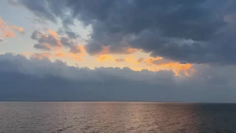 Orange Sunset Afterglow and Dark Clouds over Erhai Lake Stock-Footage 333545657
