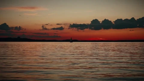 An orange sunset against dark clouds. Stock Footage 286033015
