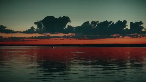 Orange sunset against dark clouds. Stock Footage 286033065