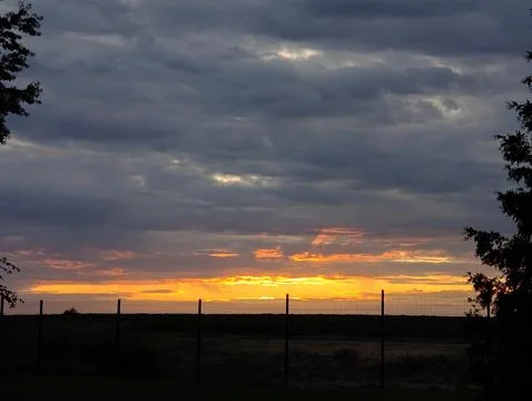 Orange sunset and clouds Stock Photos