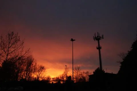 Orange sunset with antenna Stock Photos