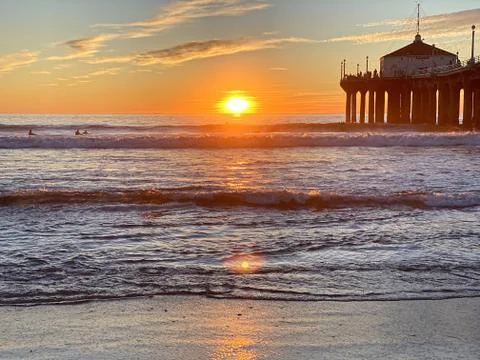 Orange sunset on the beach Stock Photos