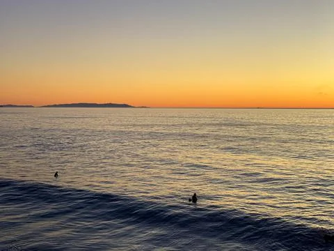Orange sunset on the beach Stock Photos