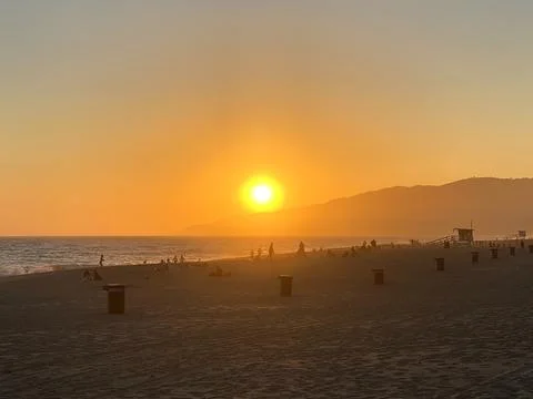 Orange sunset at the beach Stock Photos