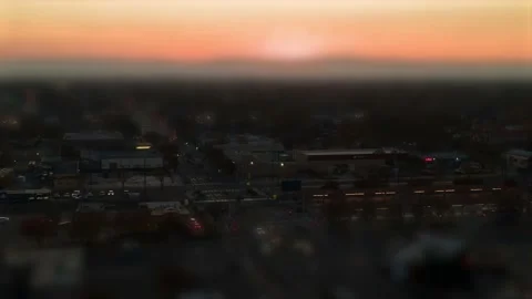 Orange Sunset behind mountains Hyperlapse tilt shift effect at Sunset Video stock 144648767