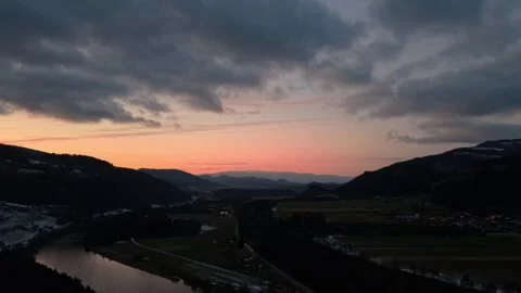 Orange sunset with clouds and hills by the river Stock Footage 325678843