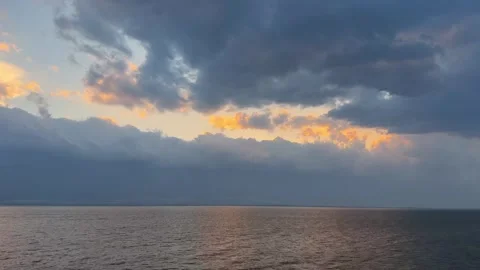 Orange sunset clouds over Erhai Lake at dusk Dali Yunnan Stock Footage 333749424