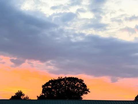 An orange sunset with clouds Foto stock
