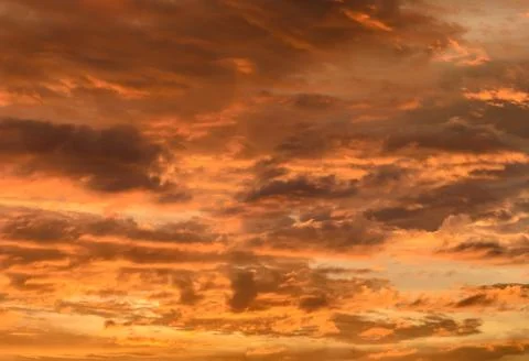 Orange sunset with cloudscape Stock Photos