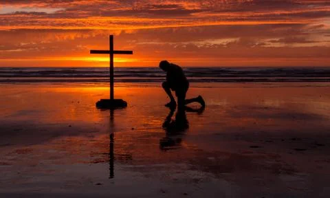 Orange sunset cross Stock Photos