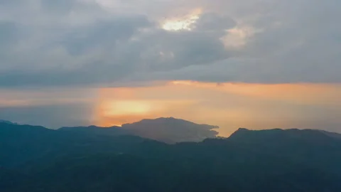 Orange sunset, dark blue rain clouds above mountain range, Phuket, Thailand Video stock 173400421