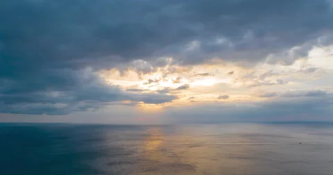 Orange sunset, dark blue rain clouds above mountain range, Phuket, Thailand Stock Footage 173841102
