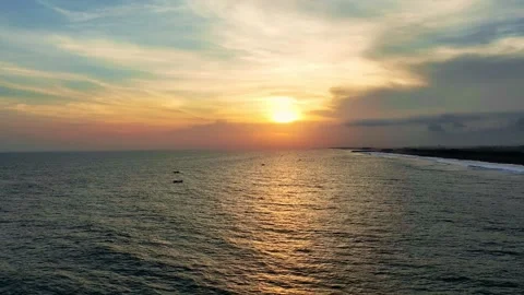 Orange sunset glowing over calm ocean horizon Stock Footage 335439990