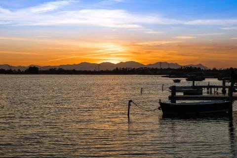 Orange sunset on laguna Stock Photos