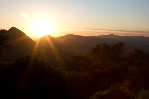 Orange sunset in the mountains Stock Photos