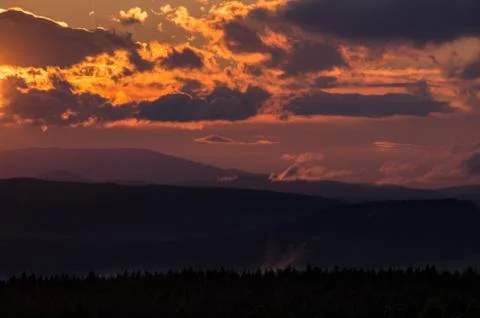 Orange sunset in the mountains. Stock Photos