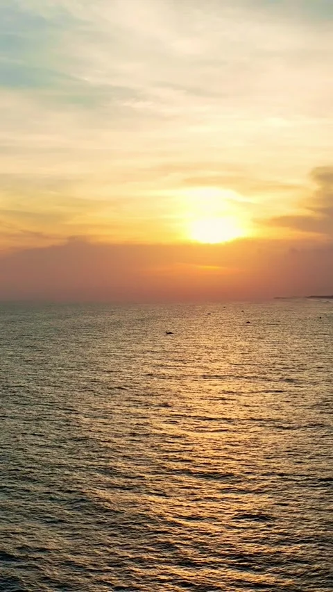Orange sunset over calm ocean horizon Video stock 335432687