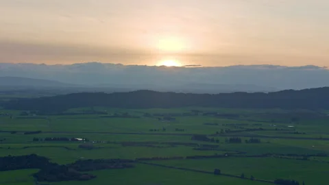 Orange sunset over farmed fields Stock Footage 155451619