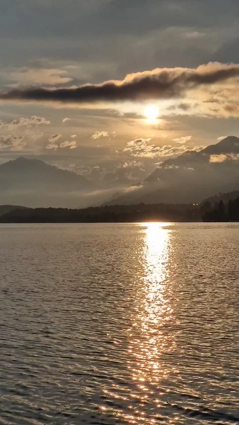 Orange Sunset over Lake with Mountain Reflections – Pure Serenity Video stock 316764789