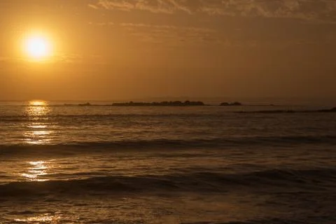 Orange sunset over the ocean Stock Photos