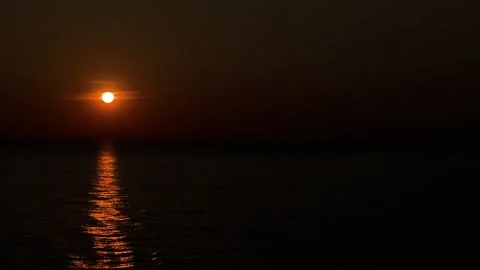 Orange sunset over the open ocean waters with copy space Stock Footage 243384634