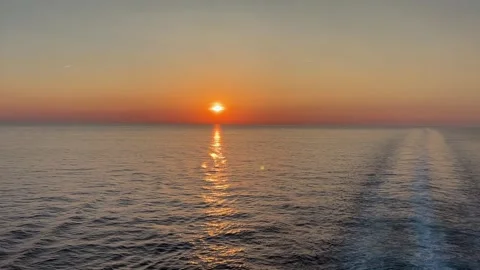 Orange sunset over the open ocean waters with copy space Stock Footage 243384702