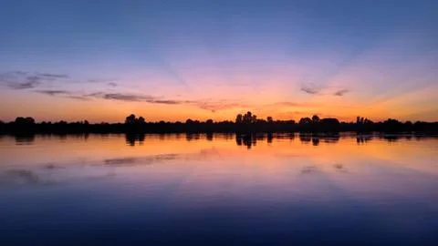 Orange sunset over the river Фото