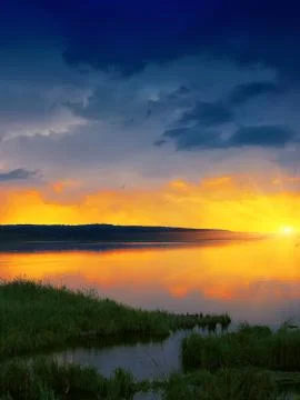 Orange sunset over river Foto stock