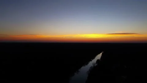 Orange sunset over the river. The river in the setting sun. Evening. Stock Footage 233117408