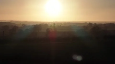 Orange sunset over silhoutted hilly wooded landcape Stock-Footage 262580652