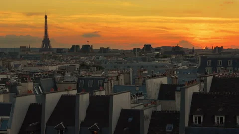 Orange sunset from a Parisian rooftop overlooking the Eiffel Tower Stock Footage 257890775