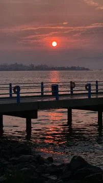 Orange sunset at the pier Stock Photos