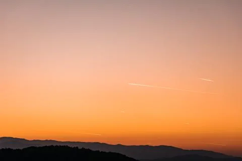 Orange sunset, with planes Stock Photos