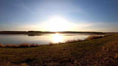 Orange sunset reflected in water Stock Footage 129030408