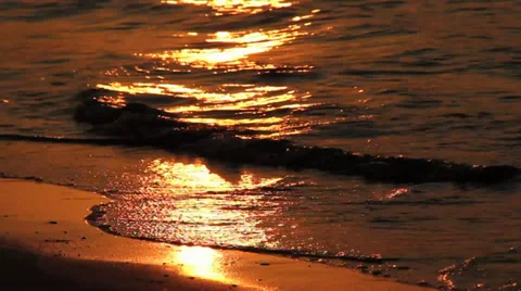 Orange sunset reflection on seashore Video stock 37348927