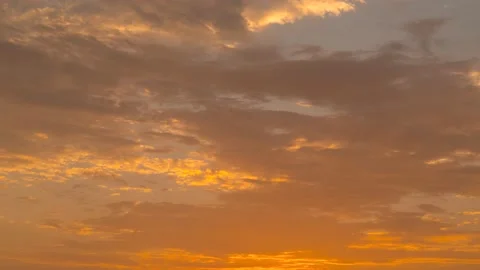 Orange Sunset Reflects Colors on Smooth Moving Clouds, No Foreground Stock Footage 236586917
