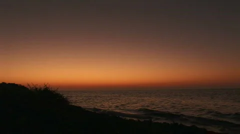 An orange sunset with shore Stock Footage 65486