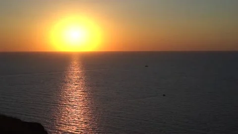 Orange sunset sky and view of the rocky coast, Cape in Crimea Stock Footage 142399482