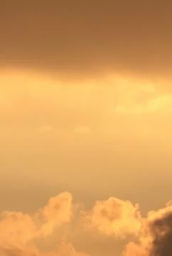 Orange sunset sky with clouds Stock Photos