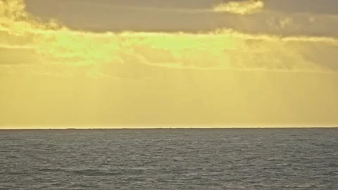 Orange Sunset Sky over Calm Ocean Waves in Tropical Evening Stock Footage 296570111