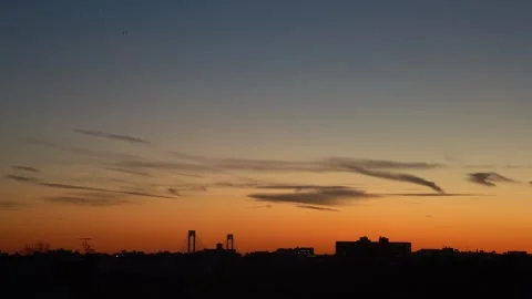 Orange sunset  sky with some wispy clouds Stock Footage 265527476