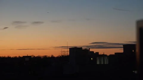 Orange sunset  sky with some wispy clouds Stock Footage 265527517